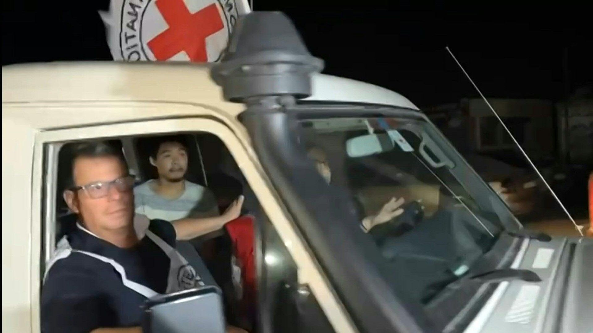 Released hostages cross the Palestinian side of the Rafah crossing with Egypt