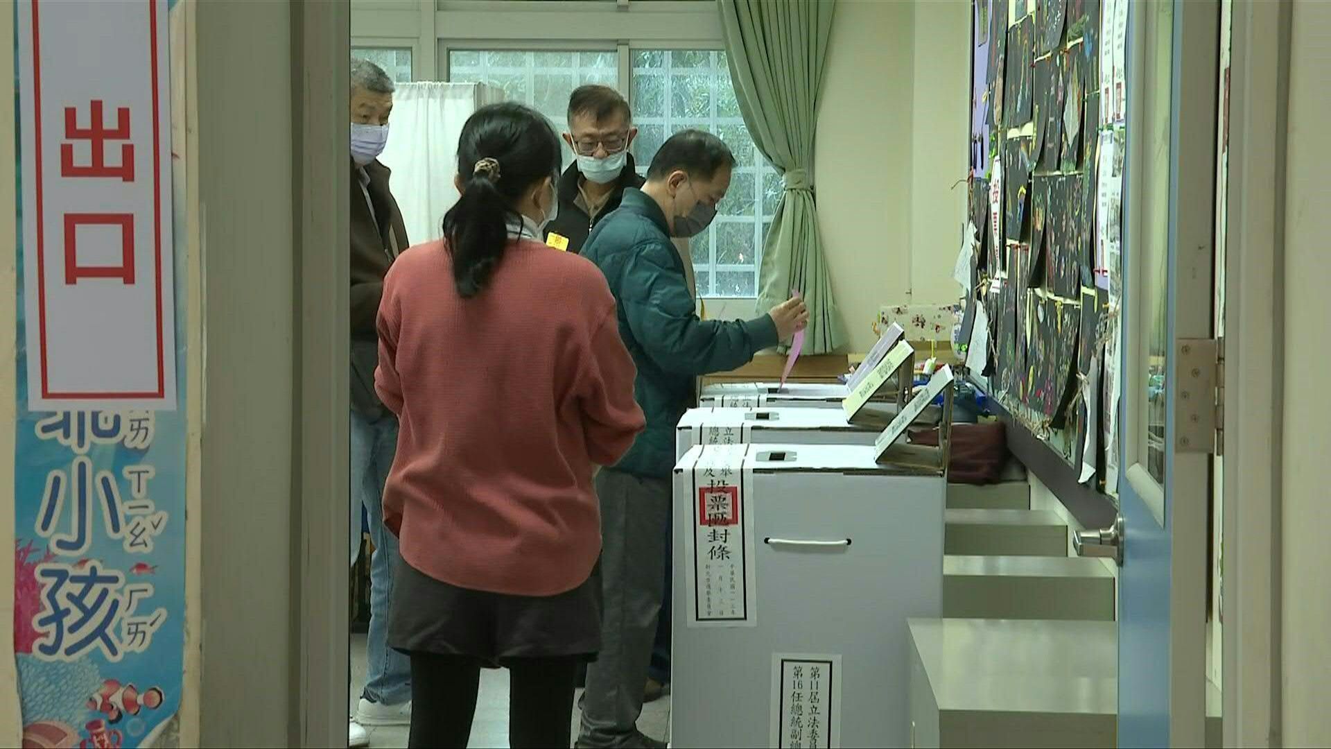Taiwanese cast their ballots at polling station in New Taipei