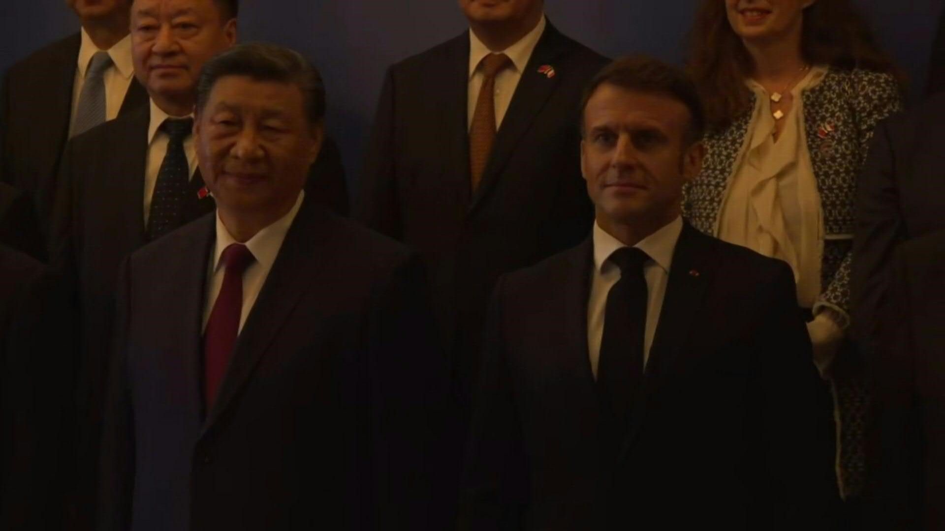 Presidents Xi and Macron pose for the media