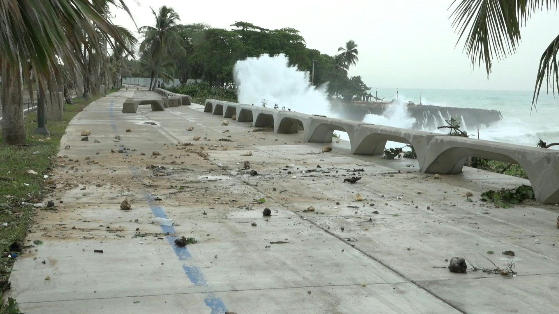 High tide, debris along Santo Domingo coast after passage of Hurricane Beryl