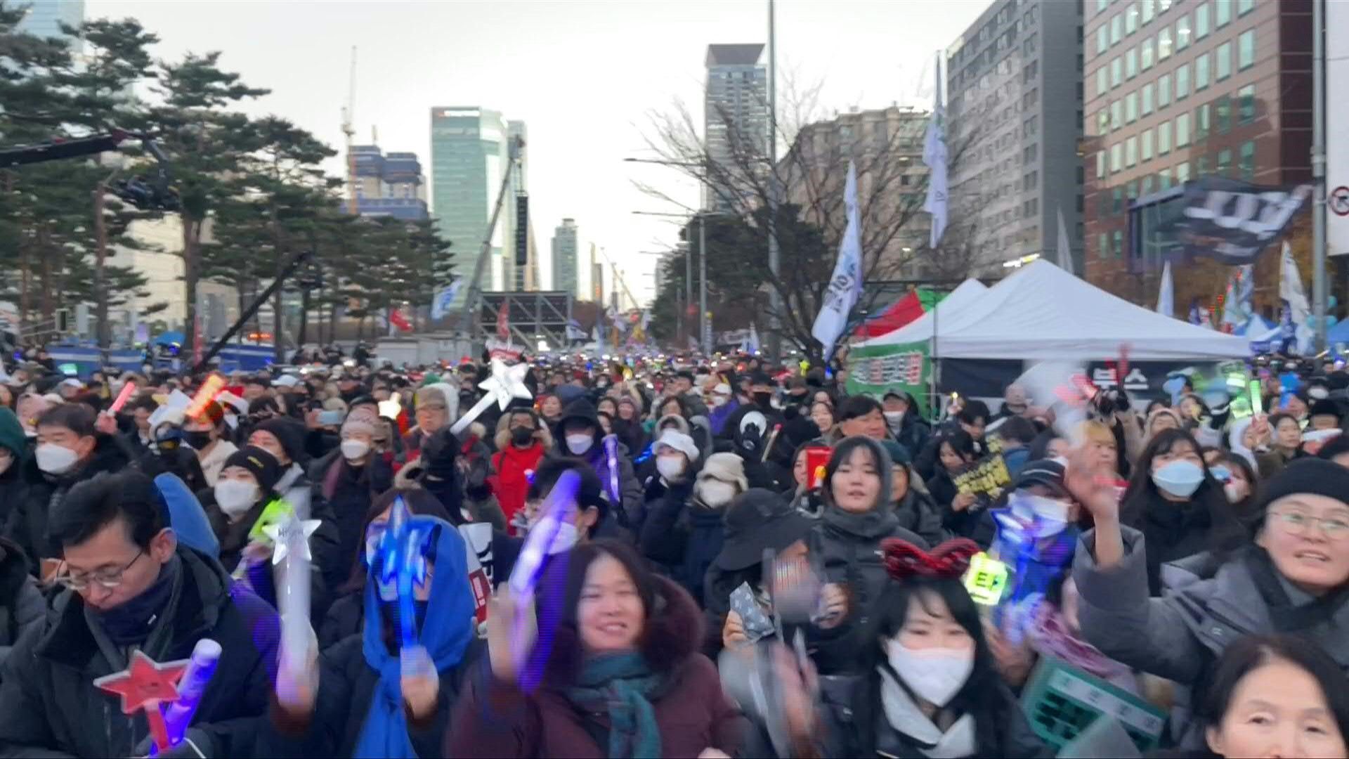 People celebrate President Yoon's impeachment in Seoul
