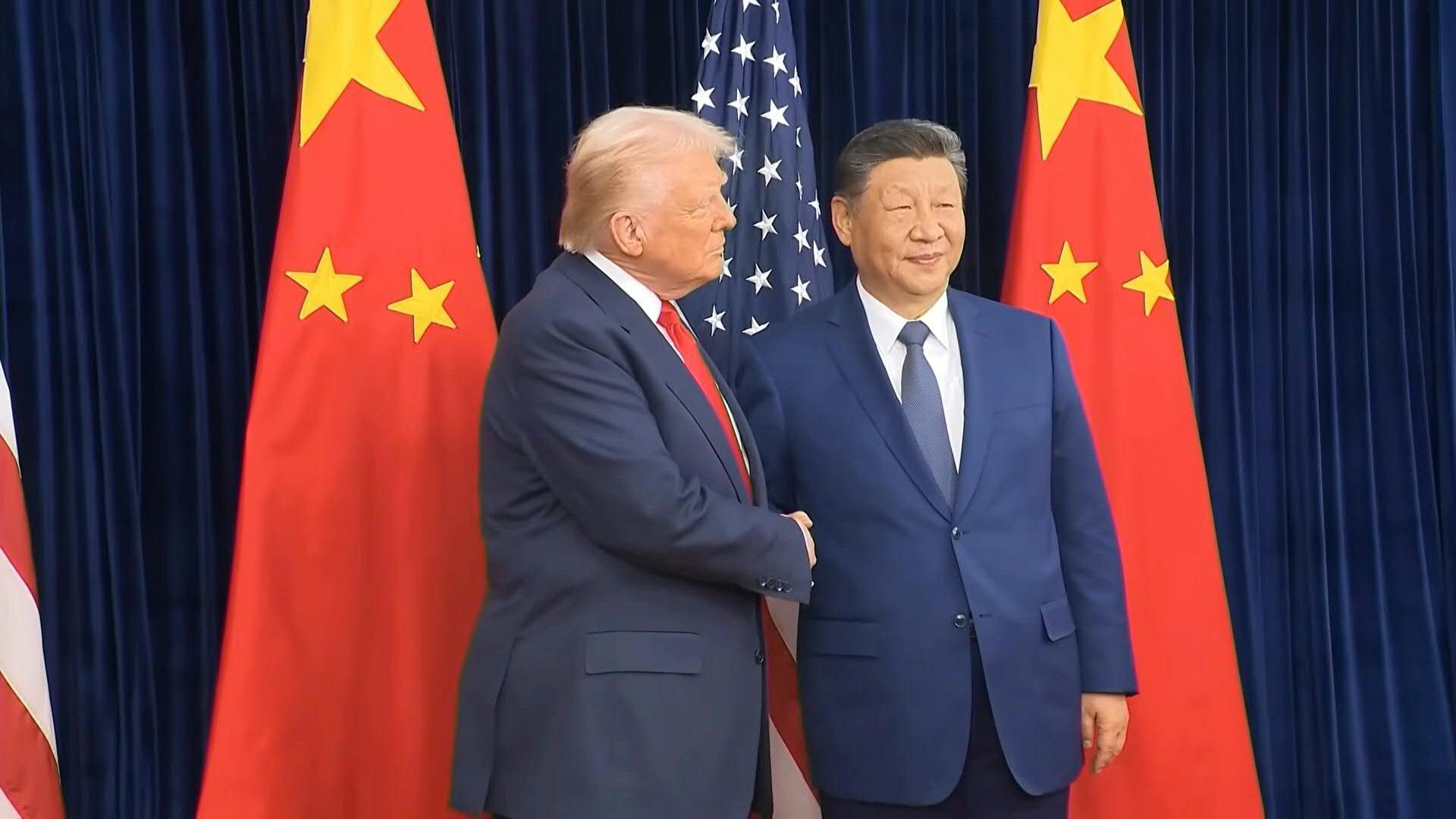 Trump and Xi shake hands as they meet to hold trade talks
