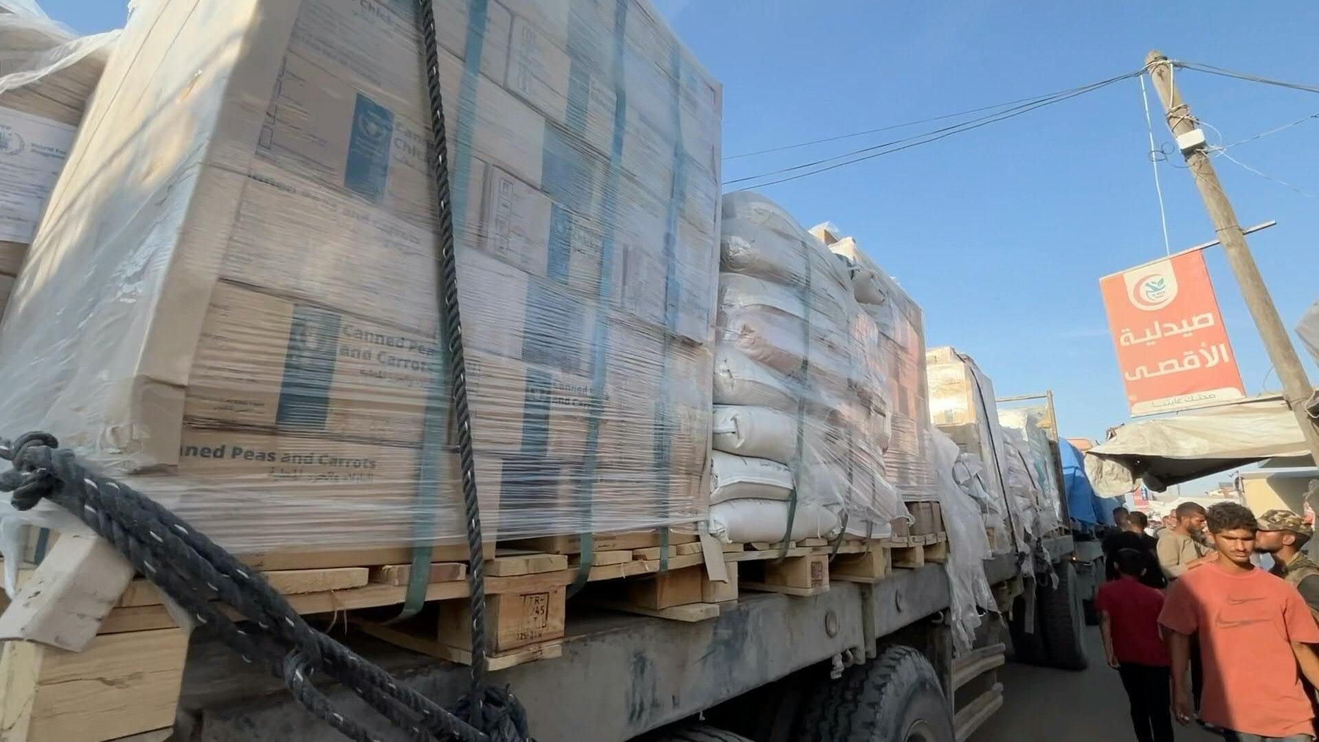 Trucks carrying WFP aid pass by Gaza's Khan Yunis
