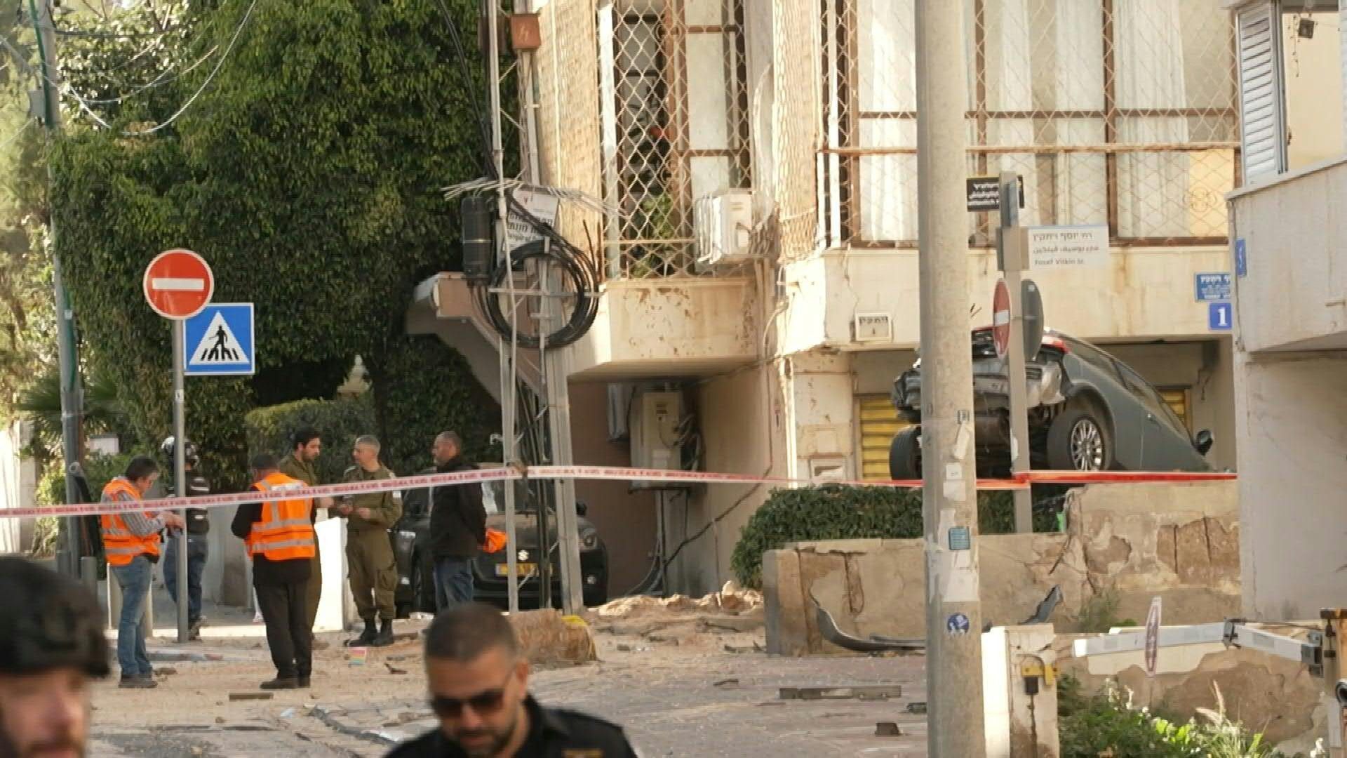 Video: Emergency workers on scene as building in Tel Aviv damaged after missiles intercepted