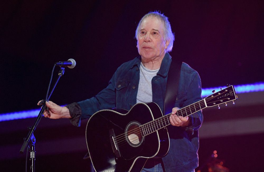 Paul Simon has successfully undergone surgery for 'chronic and intense back pain'