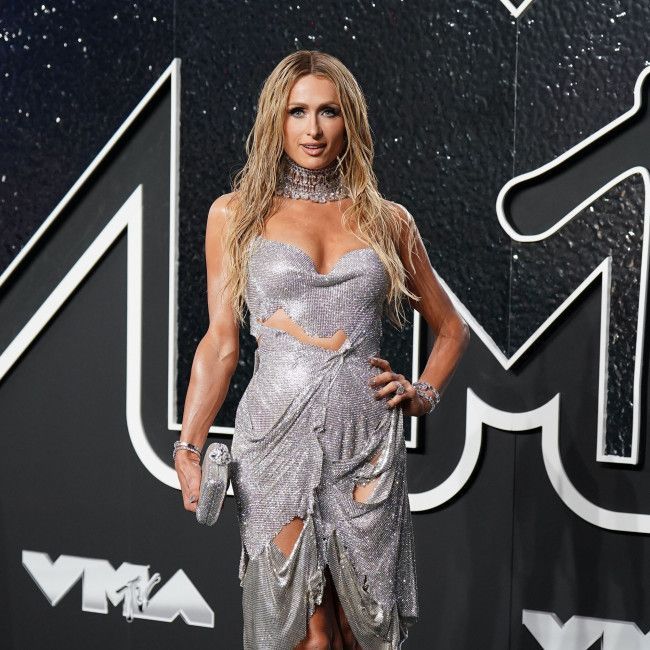 Paris Hilton passing down love for animals to kids