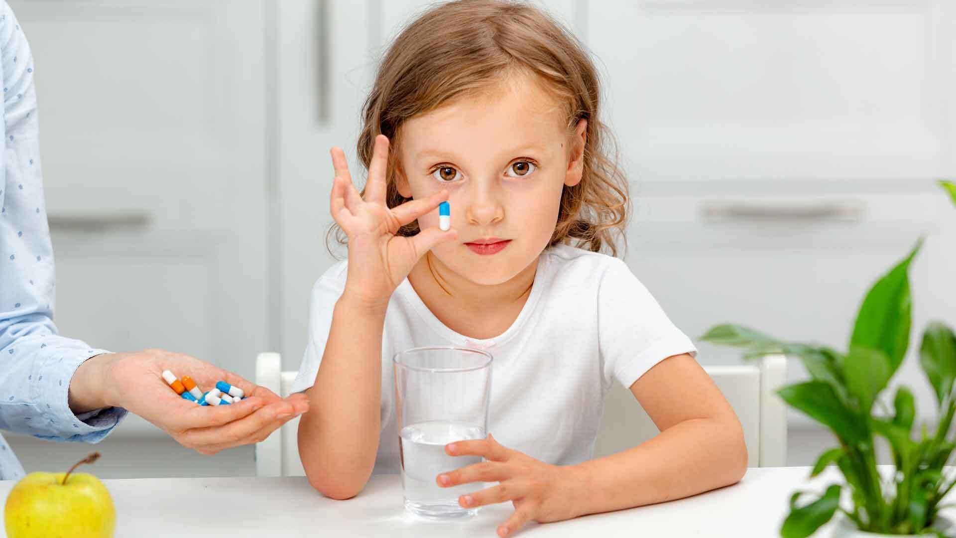 How does my child learn to swallow pills?