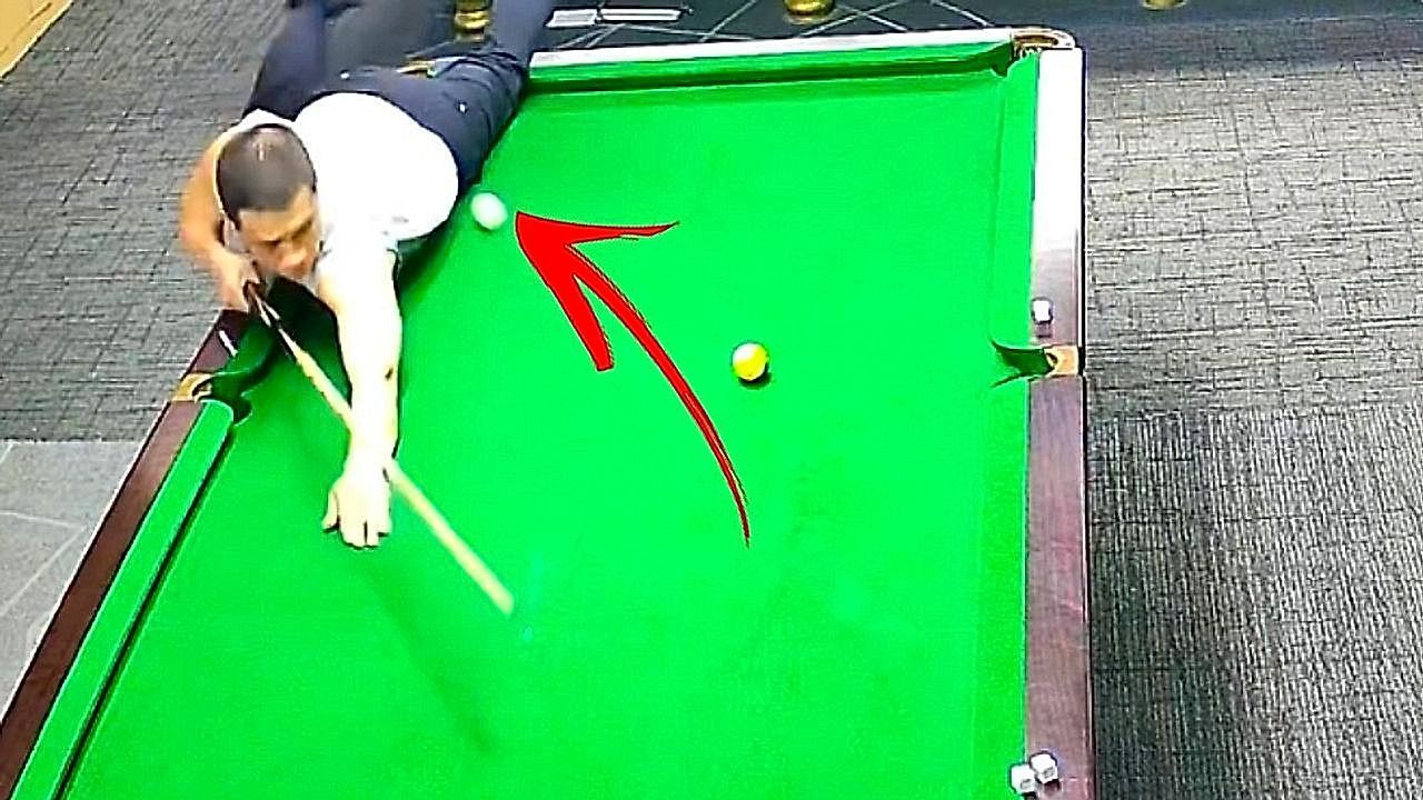 Video: Cue ball lands in a player's pocket in a hilarious billiards error.