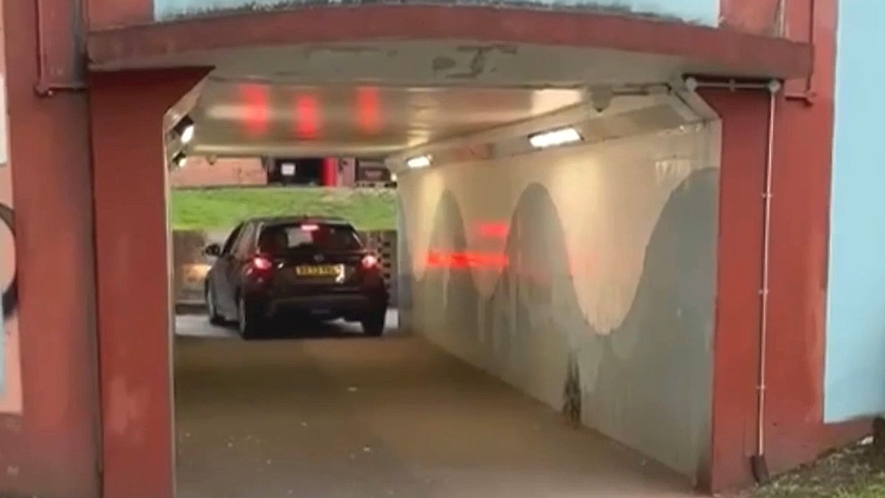 Video: Dozy driver wedges car in underpass after 'getting lost' in UK town