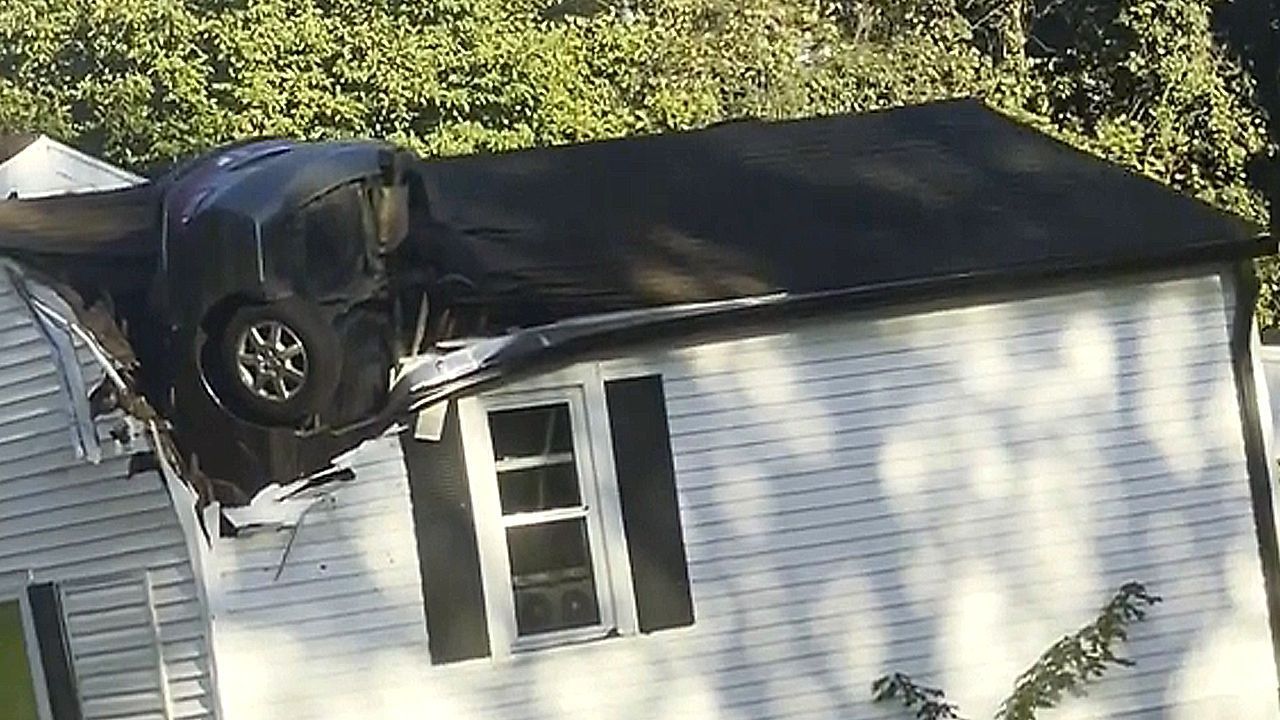 Car-somehow-crashed-vertically-through-Tennessee-home-s-roof