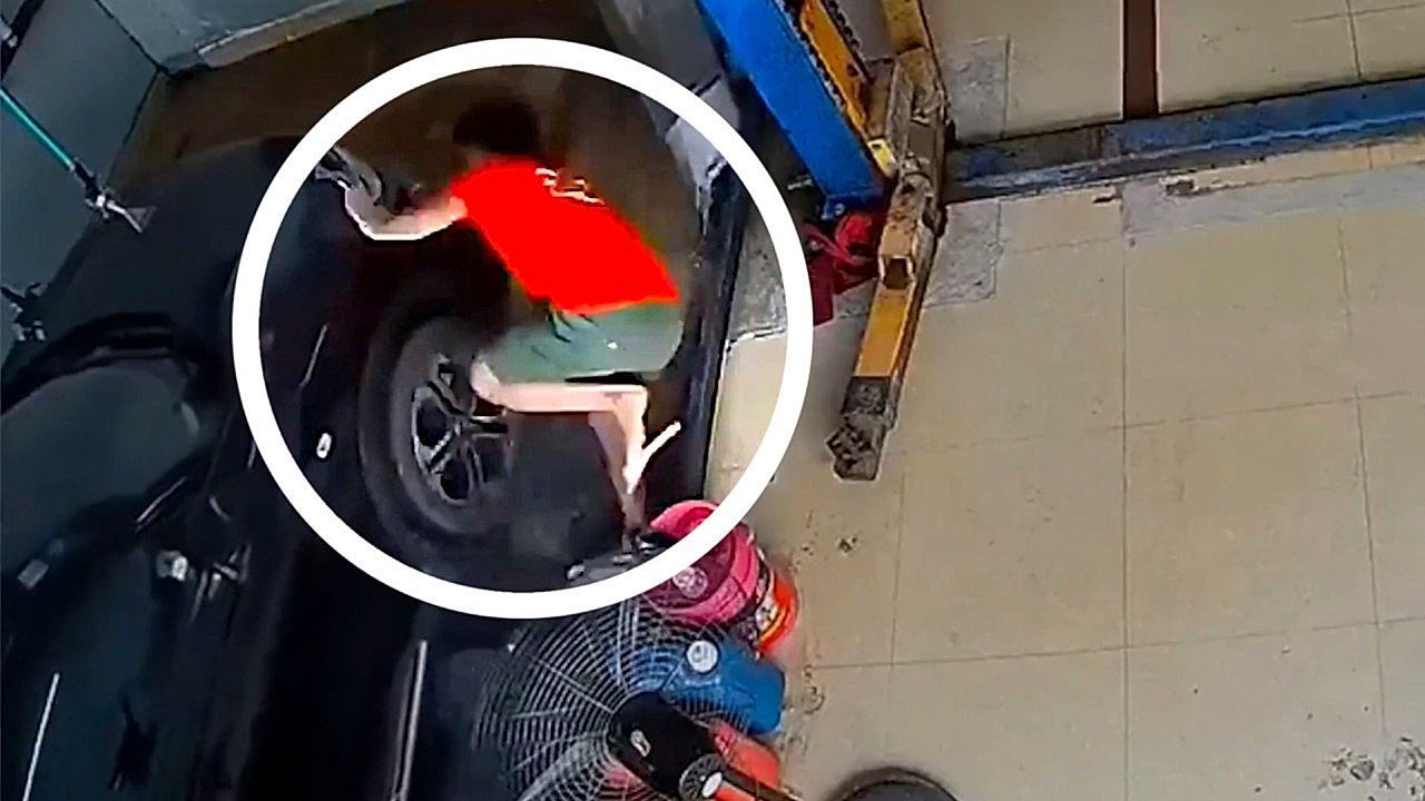 Slip 'n slide! Car wash worker hilariously wiped out by runaway floor mat