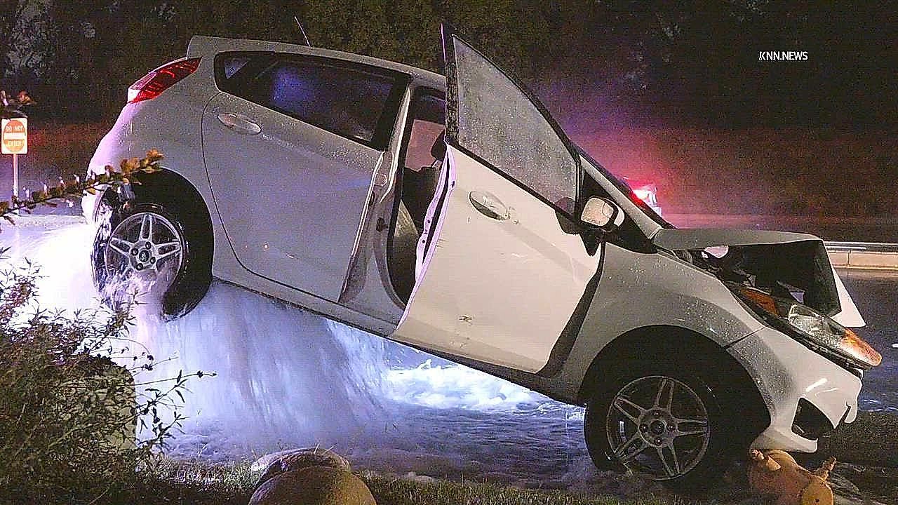 Car lifted by hydrant after driver crashes in Los Angeles