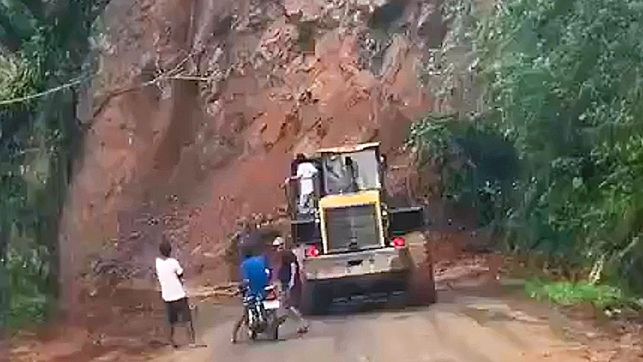 Landslide thunders onto road as stunned drivers look on