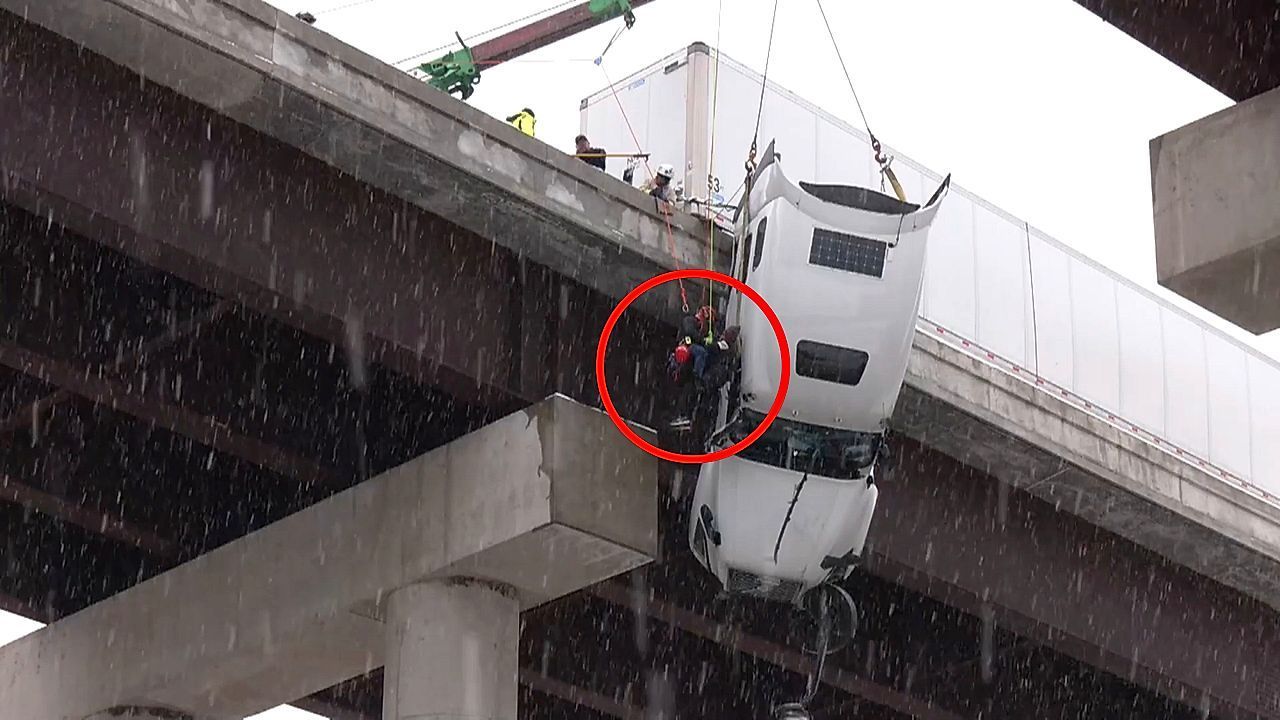 Semi-truck driver rescued after dangling off West Virginia bridge for 5 hours