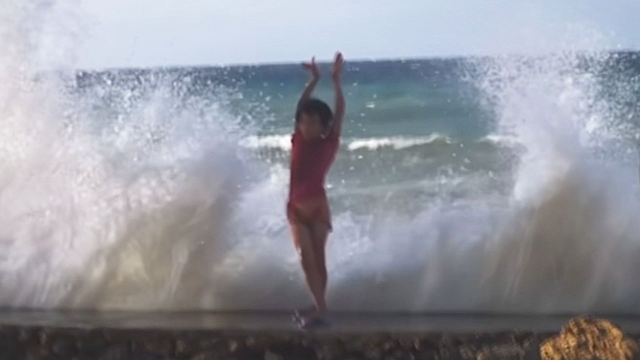 Video: Boy syncs with rolling waves in the Philippines