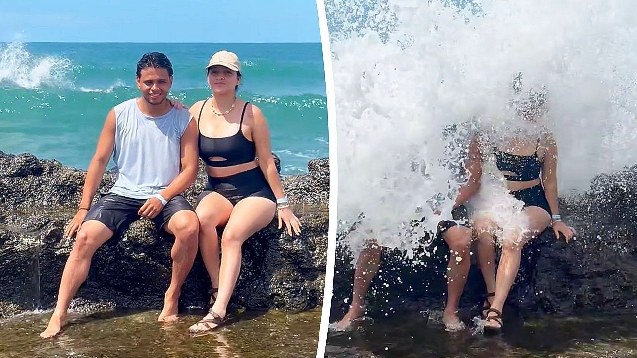 Video: Wave wipes out couple posing for seaside photo