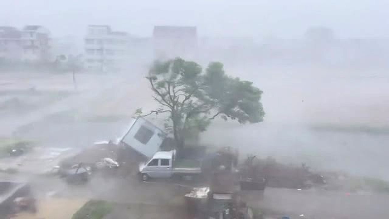 Video: Powerful winds send small house rolling across yard during Typhoon Dolphin