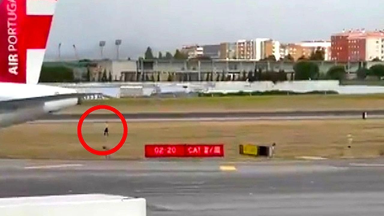 Video: Man strolls across Lisbon Airport runway as aircraft roars behind him