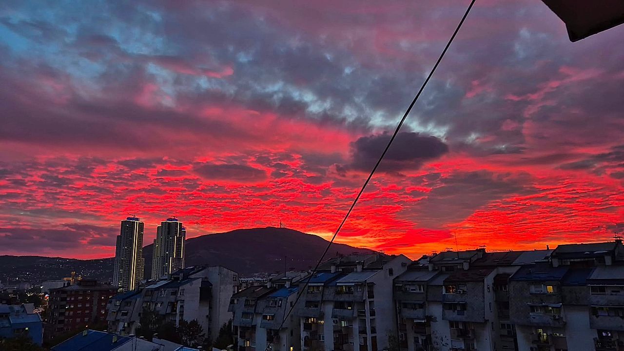 Vivid pink and orange sunset paints the sky above Macedonia in stunning display
